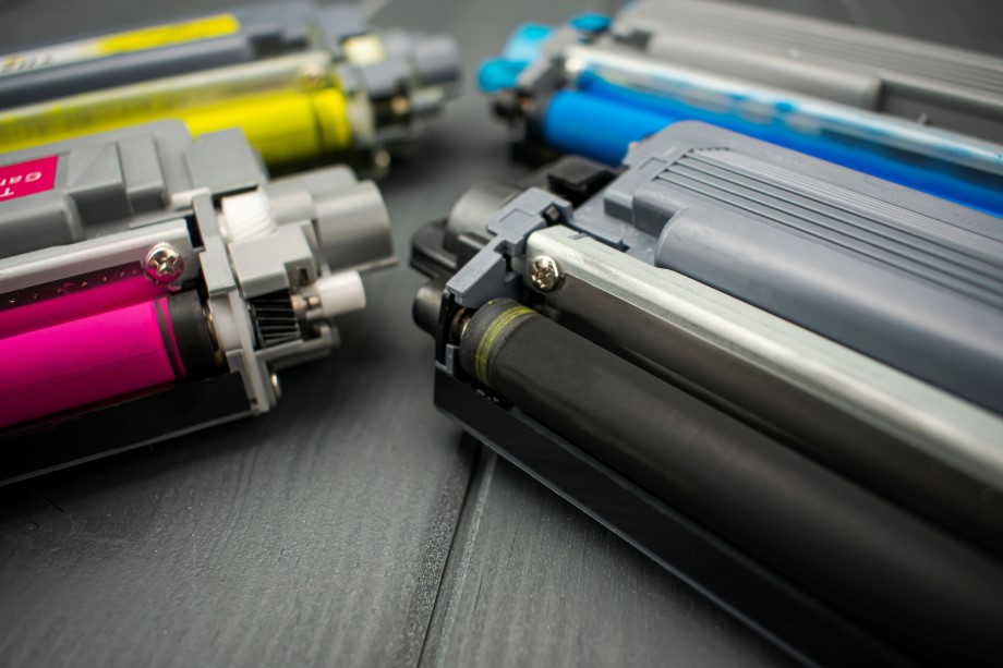 Cyan, magenta, yellow and black color toner rollers of a foreground color laser printer